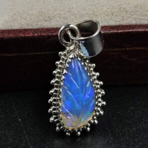 Ethiopian Opal Carved 1.25" 925 Sterling Silver Pendant (REXT59-100)