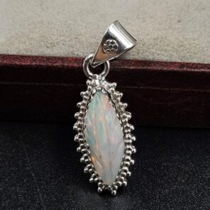 Ethiopian Opal Carved 1.25" 925 Sterling Silver Pendant (REXT59-112)