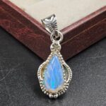 Ethiopian Opal Carved 1.25" 925 Sterling Silver Pendant (REXT59-114)