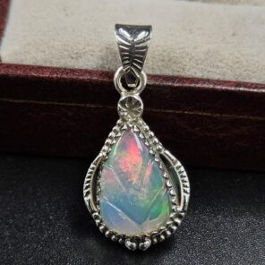Ethiopian Opal Carved 1.25" 925 Sterling Silver Pendant (REXT59-121)