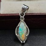 Ethiopian Opal Carved 1.25" 925 Sterling Silver Pendant (REXT59-122)